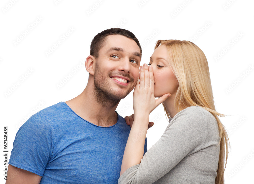 smiling girlfriend telling boyfriend secret smiling girlfriend telling boyfriend secret