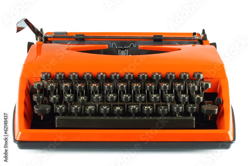 Vintage typing machine on white background .