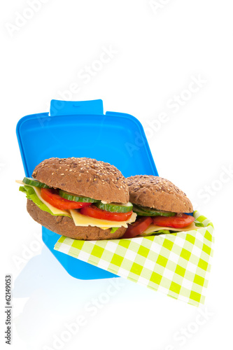 healthy brown bread roll in blue lunch box