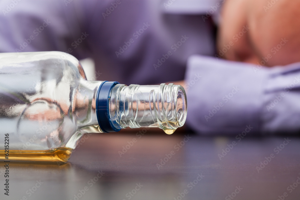 Almost empty bottle of alcohol Almost empty bottle of alcohol