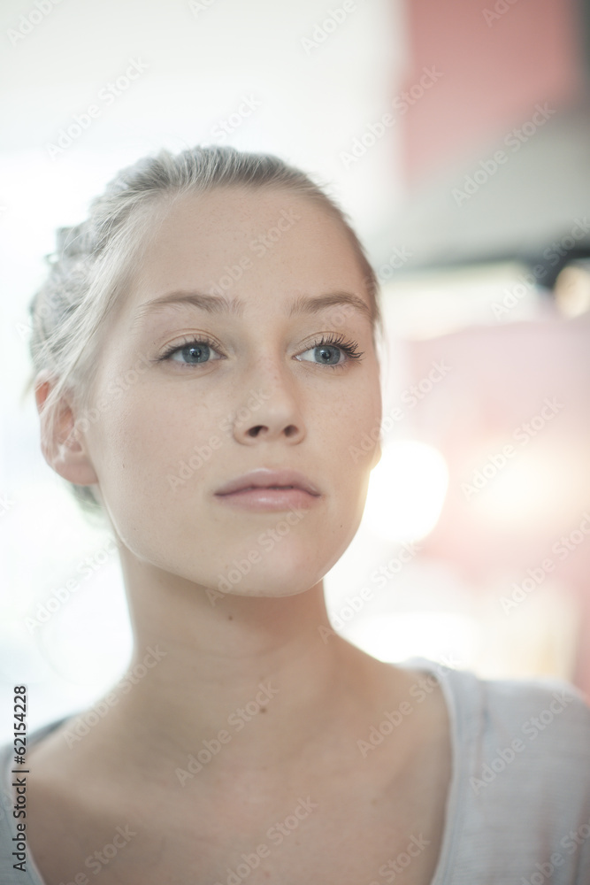 closeup of a beautiful young woman looking herself in a mirror closeup of a beautiful young woman looking herself in a mirror