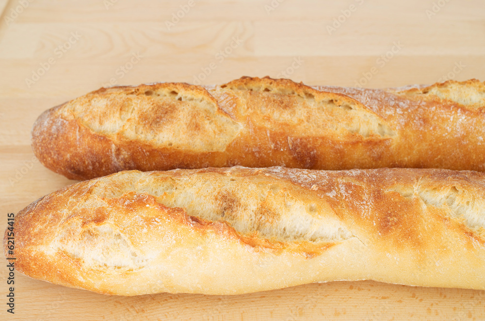 French Bread Baguette on wooden cutting board