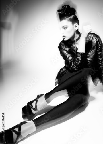 beautiful punk woman model posing in leather jacket
