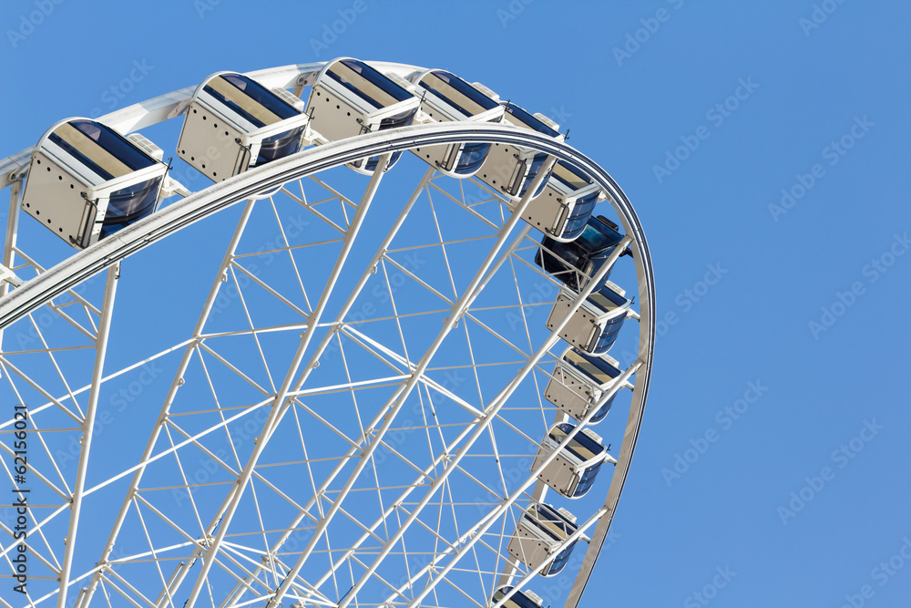 ferris wheel in the park with clear blue sky and empty space for ferris wheel in the park with clear blue sky and empty space for