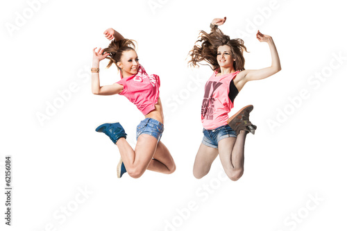 cool looking two dancing women on white background