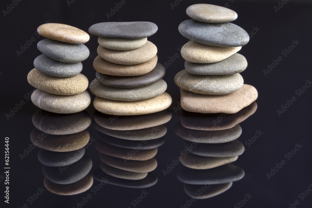 Garden of stones: Sea stones laid in piles reflected Garden of stones: Sea stones laid in piles reflected