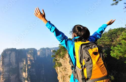 woman hiker open arms at zhangjiajie national forest park