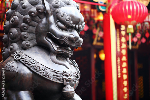 Lion statue in front of chinese temple