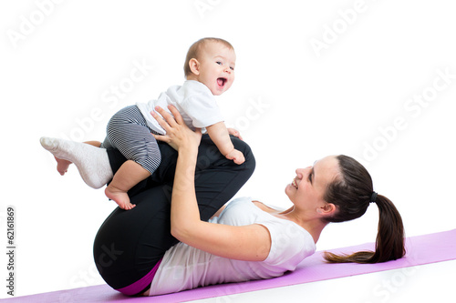 mom with child do gymnastic...