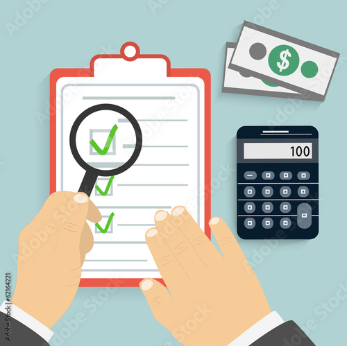 Businessman holding a clipboard and writing