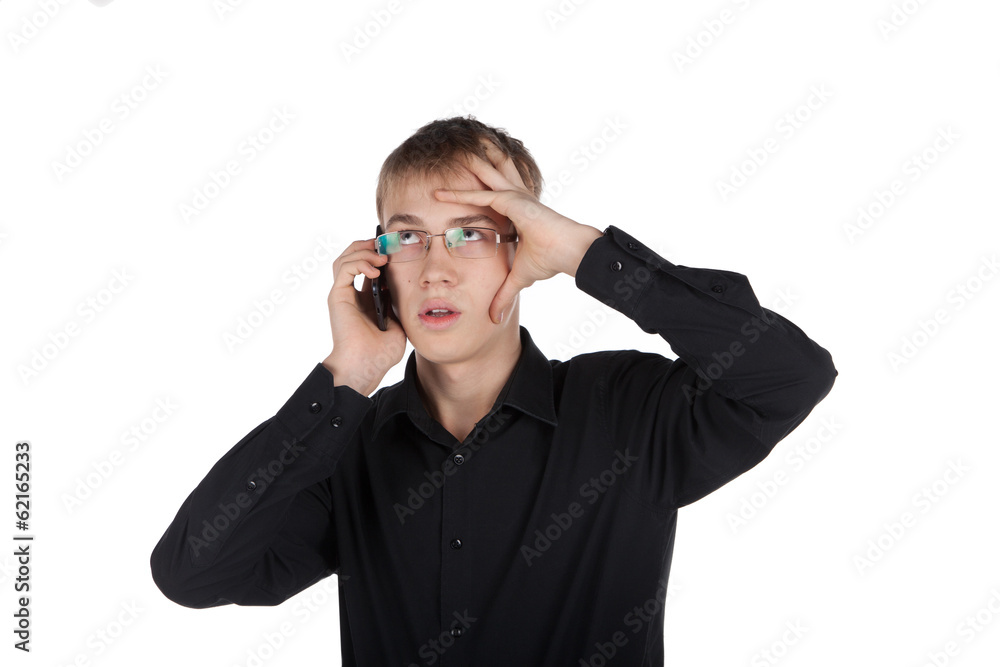 teenager in glasses thoughtfully talking on the phone teenager in glasses thoughtfully talking on the phone