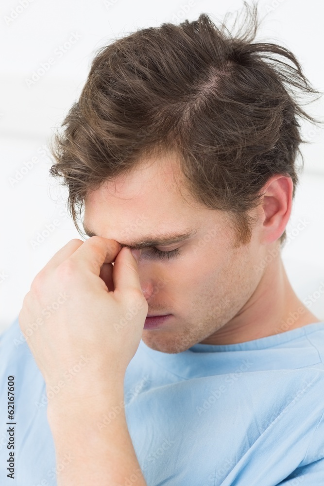 Male patient suffering from headache Male patient suffering from headache