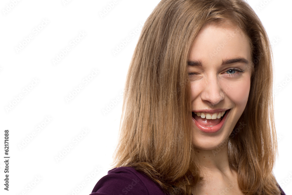 Sassy young woman giving a mischievous wink Sassy young woman giving a mischievous wink