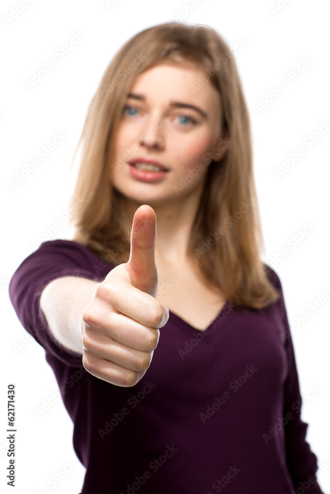 Young woman giving her vote of approval Young woman giving her vote of approval
