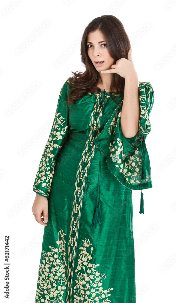 woman in arab dress speaks on phone woman in arab dress speaks on phone