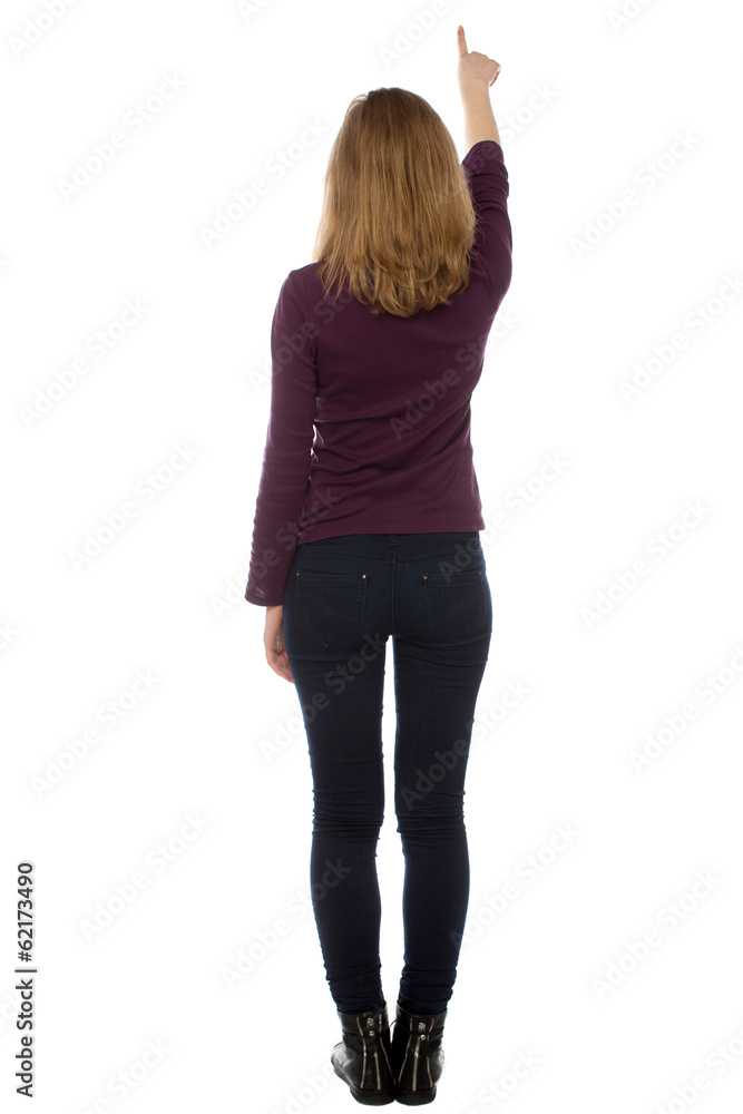 Woman standing writing or pointing upwards Woman standing writing or pointing upwards