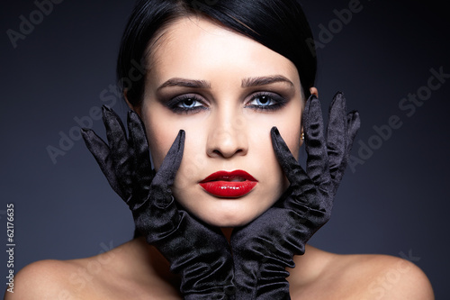 Woman in black gloves