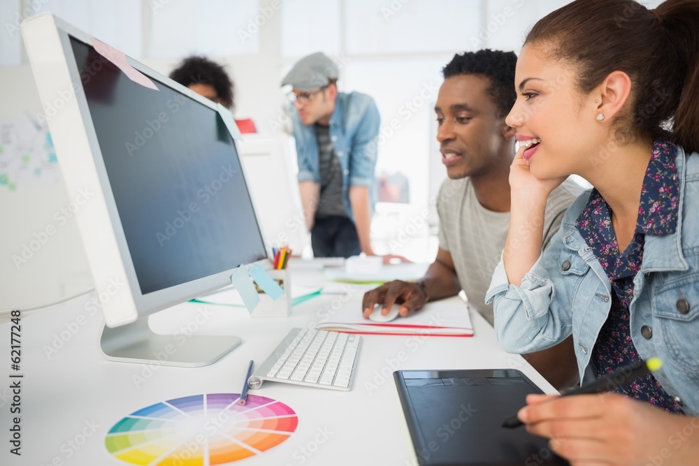 © WavebreakmediaMicro - Casual photo editors using graphics tablet