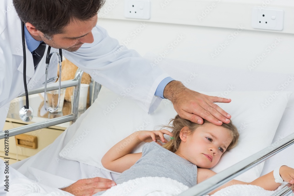 Doctor checking temperature of sick girl Doctor checking temperature of sick girl