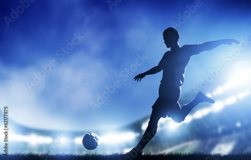 Tablou canvas Football, soccer match. A player shooting on goal