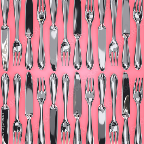 Top View Of Knives And Forks On Pink Background