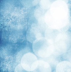 White bokeh on grungy blue background