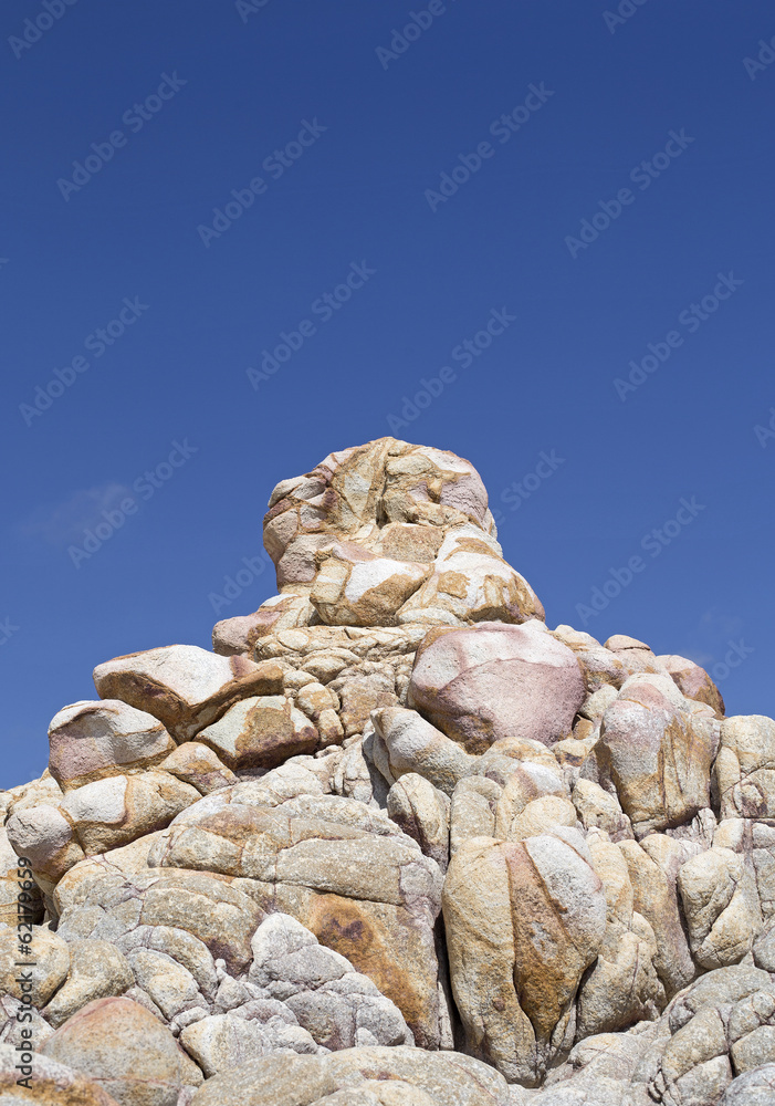 giant sand rock over blue sky in los cabos mexico
