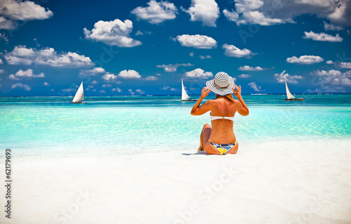 Woman relax on the beautiful tropical beach. photo