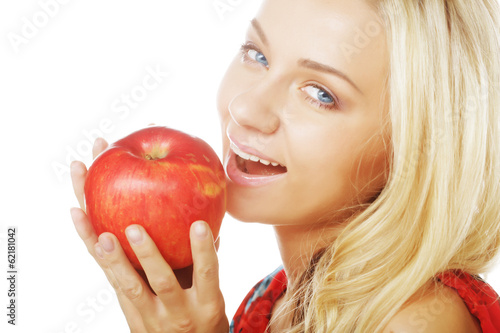 woman with an apple ahainst white background photo