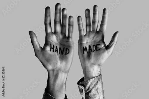 Man showing handmade word on his hands.