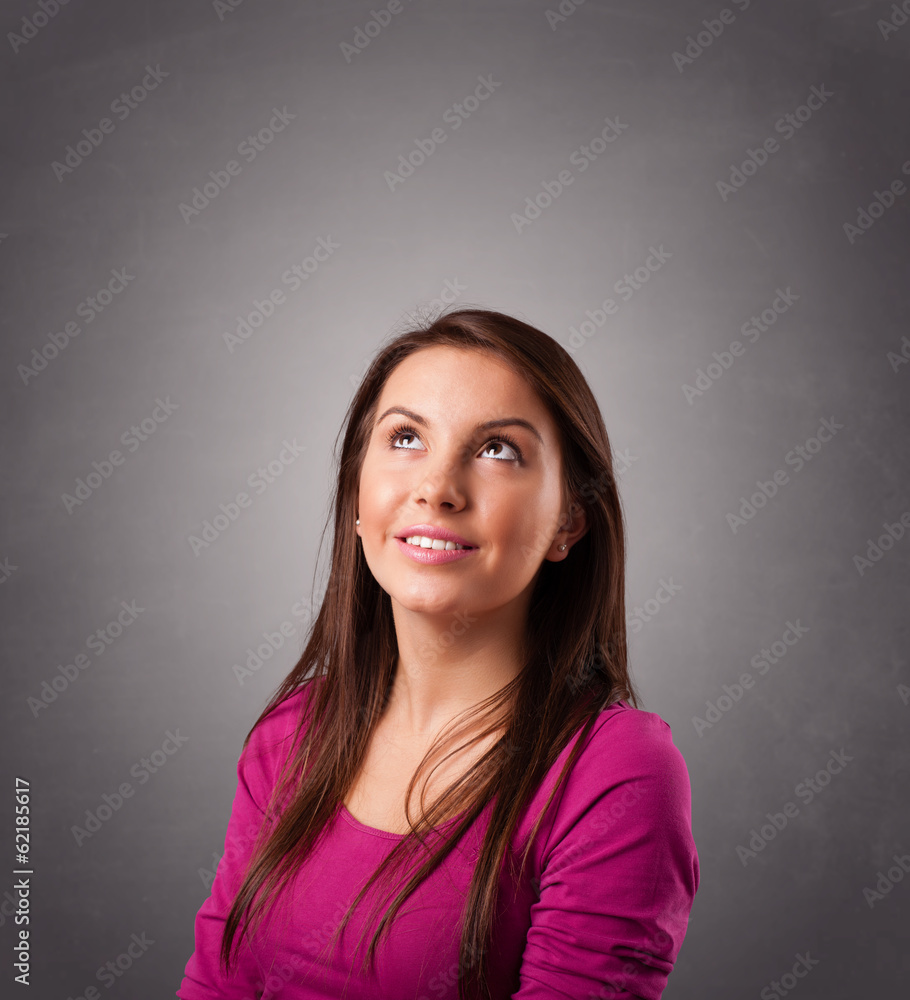 Young woman standing and thinking with copy space Young woman standing and thinking with copy space