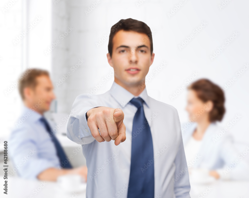 friendly young buisnessman pointing finger friendly young buisnessman pointing finger