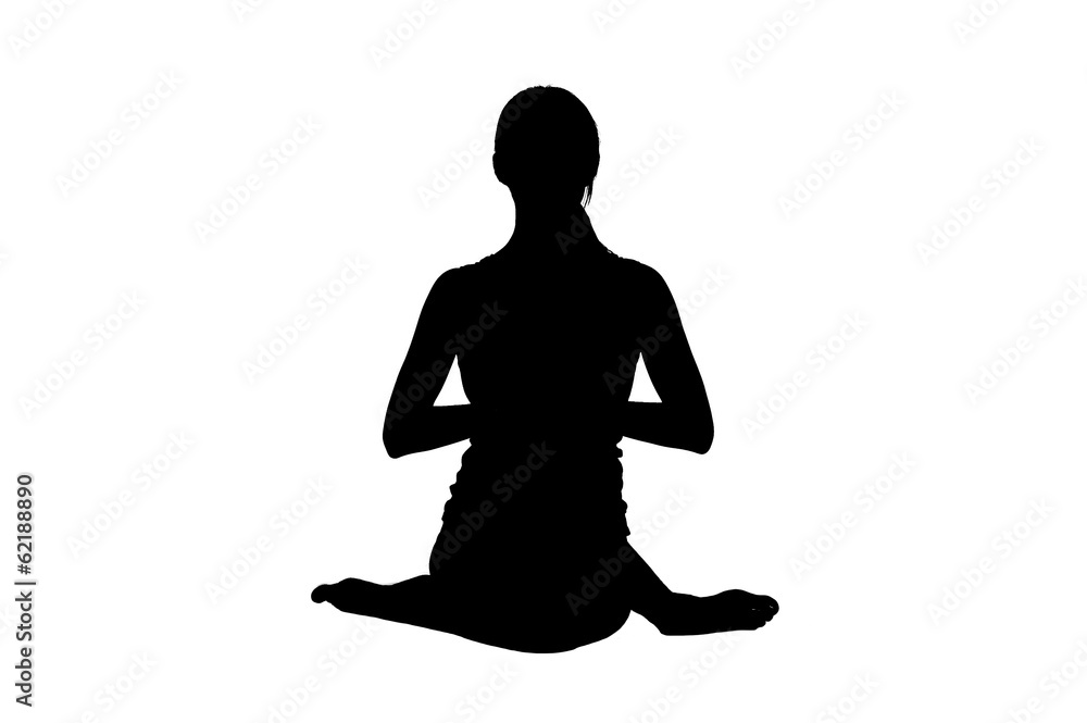Silhouette of beautiful young woman in great shape practicing yo Silhouette of beautiful young woman in great shape practicing yo