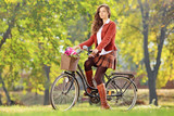 Beautiful female on her bicycle in a park