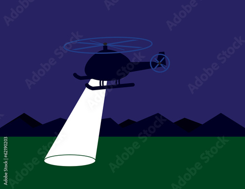 Helicopter searching at night with spotlight