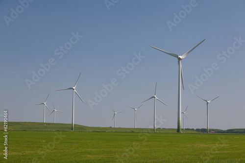 Windfarm with a clear blue sky producing alternative energy