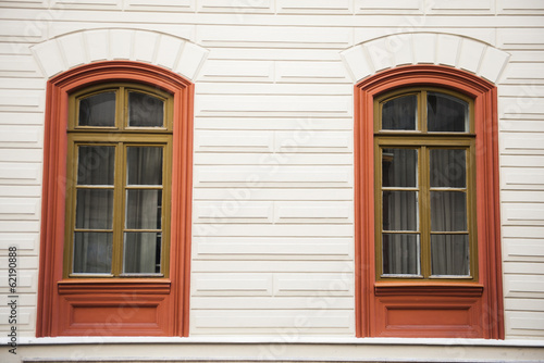 Two window red frames on a facade
