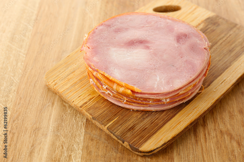 Tasty ham on wooden background
