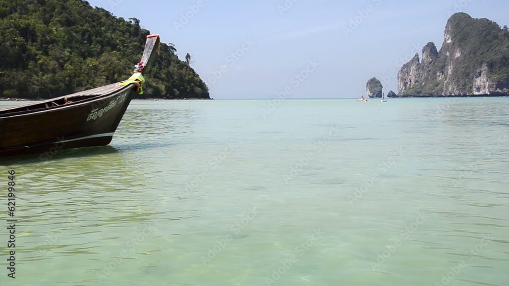 phi phi islands, tourists on thai fishing boat phi phi islands, tourists on thai fishing boat