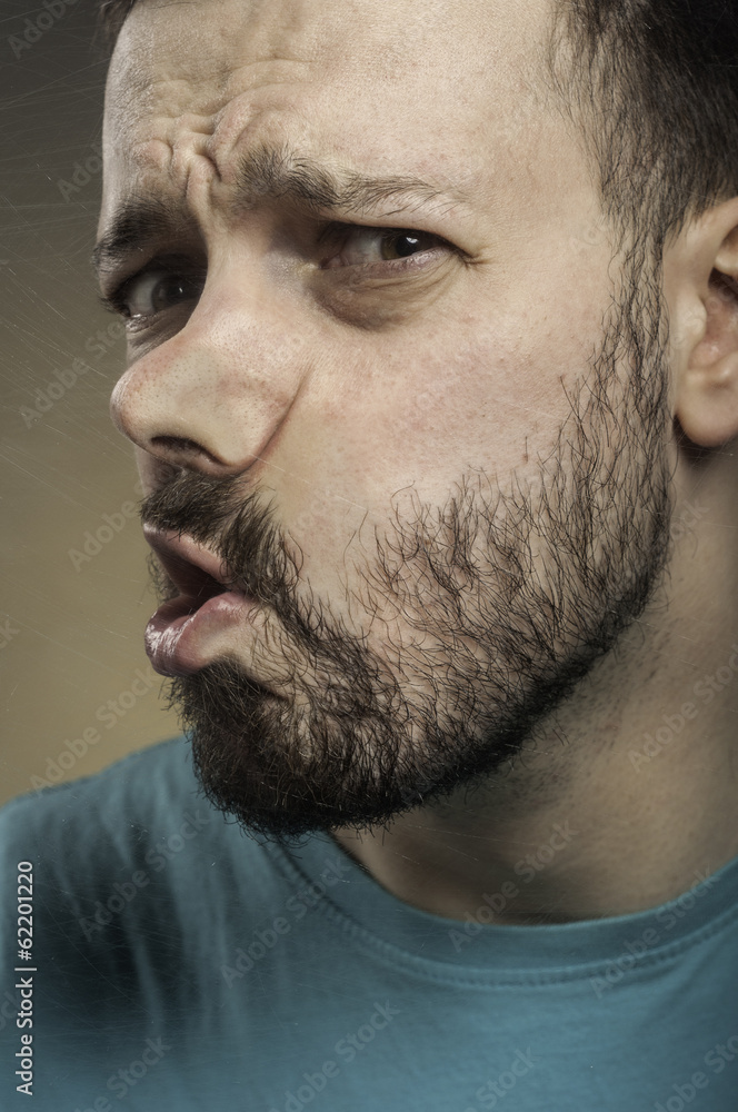 Obraz premium Funny Faces - Man Blowing Against the Glass Surface