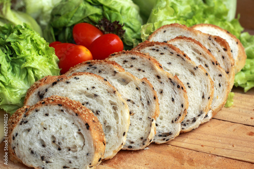 bread sprinkled with sesame -  vegetable green salad