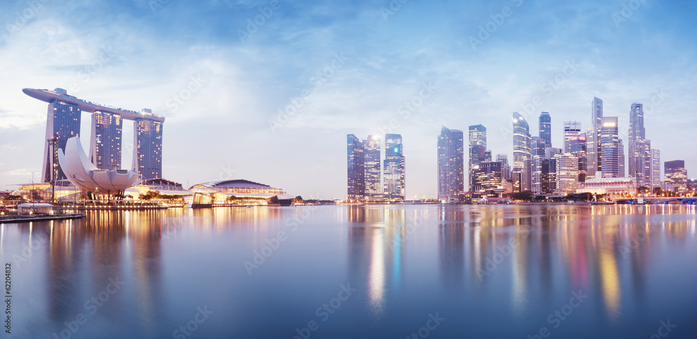 Naklejka premium Panoramic image of Singapore`s skyline at night.