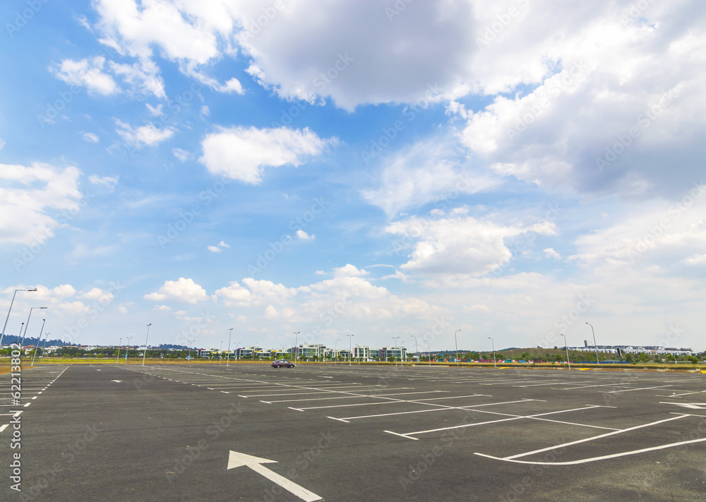 Fototapeta premium Empty parking lot with blue skies