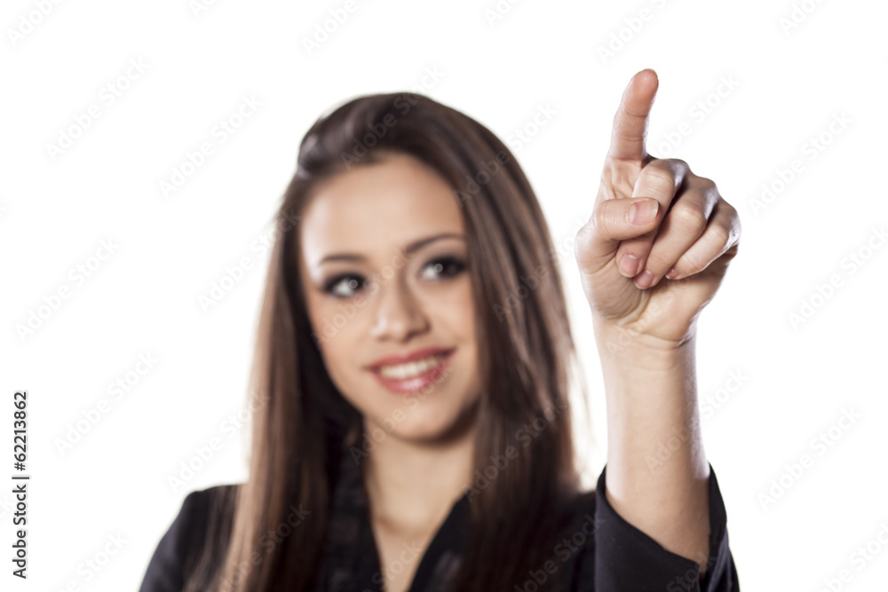 young smiling beautiful woman touching an empty space young smiling beautiful woman touching an empty space