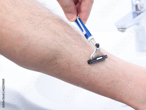 shaving legs in bathroom