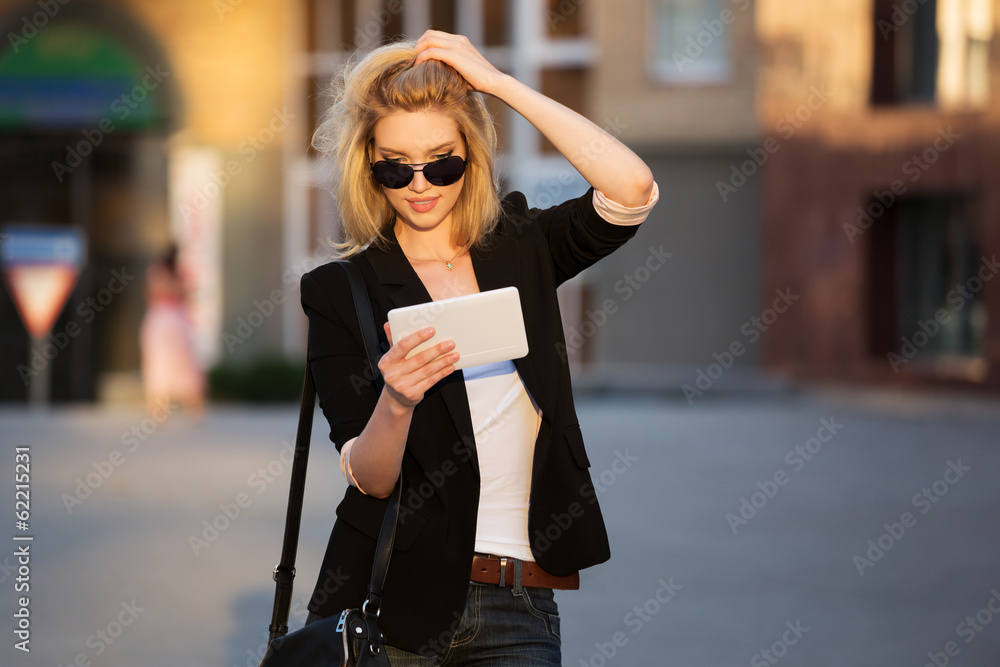 Young business woman using a tablet computer