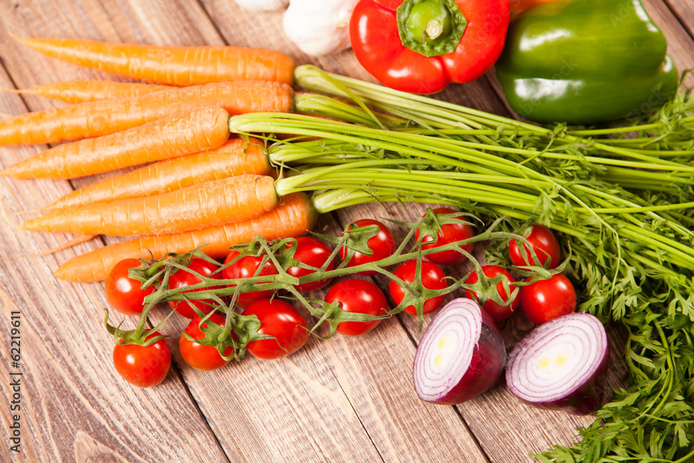 Fresh vegetables on a wooden table Fresh vegetables on a wooden table