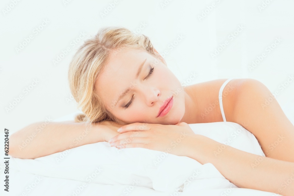 Peaceful young blonde sleeping on her bed Peaceful young blonde sleeping on her bed