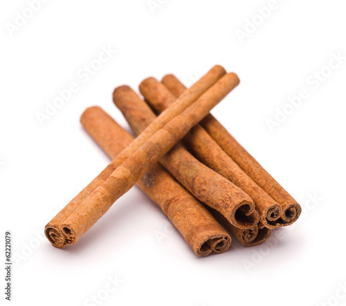 Heap of Cinnamon isolated on white