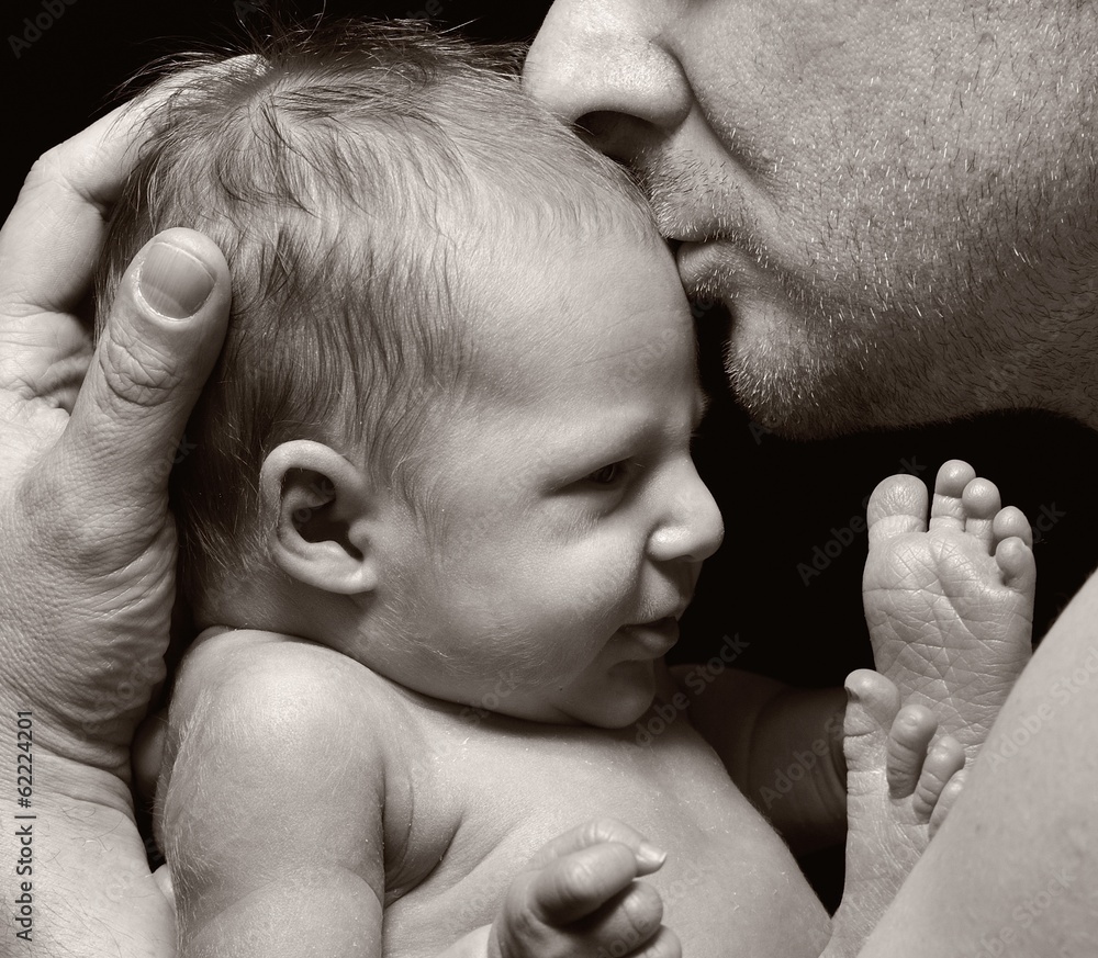 Father and his newborn baby.